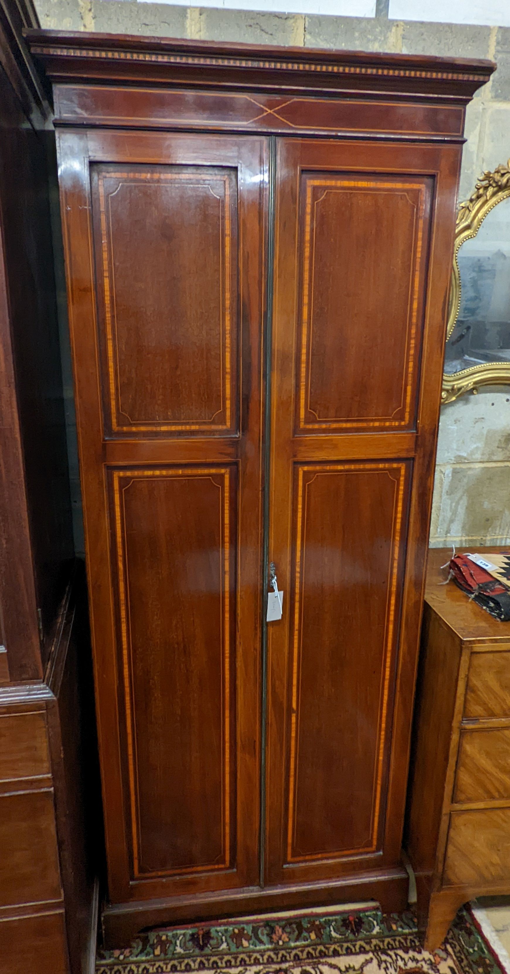 A Edwardian satinwood banded mahogany two door bookcase, width 83cm, depth 31cm, height 198cm
